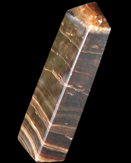 Chocolate Calcite obelisk 110*30*24mm 214g in sunlight - Rocks and Things Store