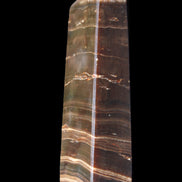 Chocolate Calcite obelisk 110*30*24mm 214g in sunlight - Rocks and Things Store