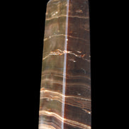 Chocolate Calcite obelisk 110*30*24mm 214g in sunlight - Rocks and Things Store