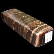 Chocolate Calcite obelisk 110*30*24mm 214g in sunlight - Rocks and Things Store