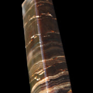 Chocolate Calcite obelisk 110*30*24mm 214g in sunlight - Rocks and Things Store