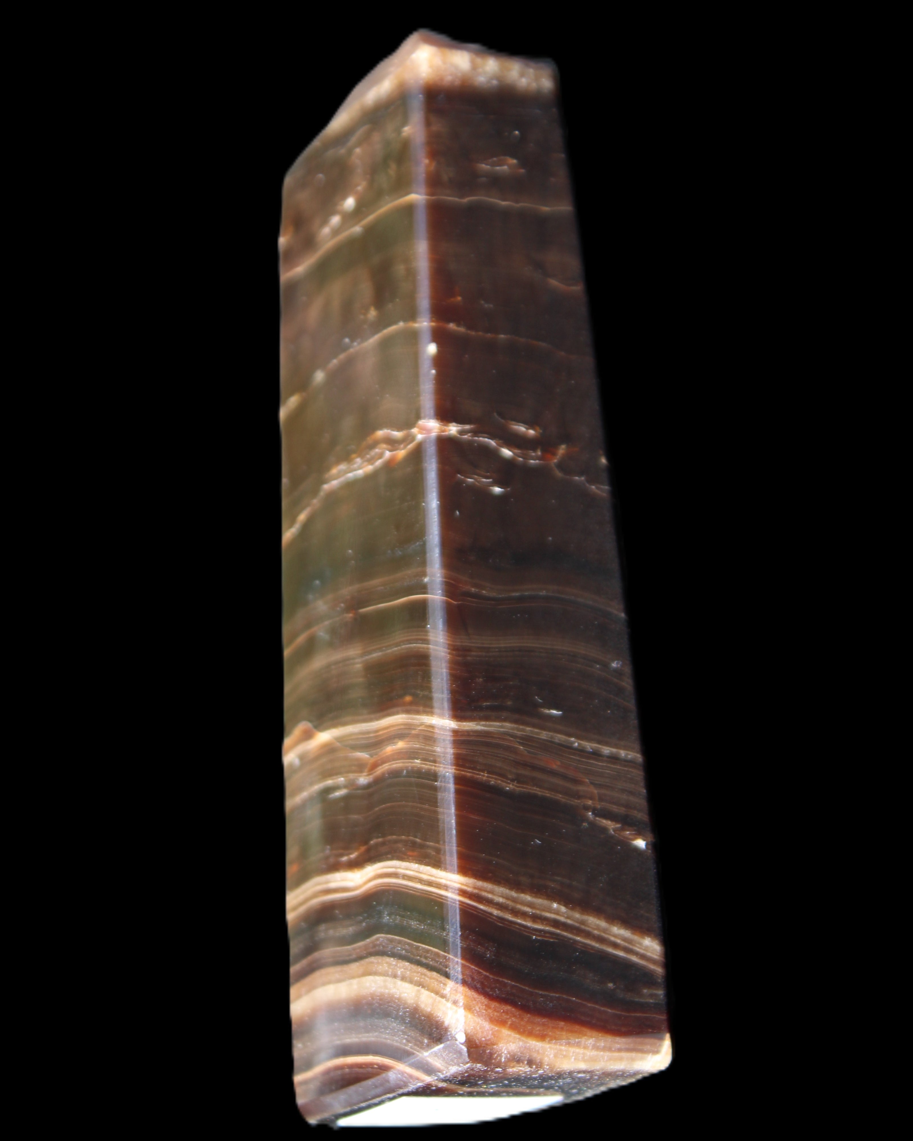Chocolate Calcite obelisk 110*30*24mm 214g in sunlight - Rocks and Things Store