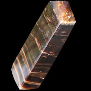 Chocolate Calcite obelisk 110*30*24mm 214g in sunlight - Rocks and Things Store