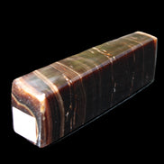 Chocolate Calcite obelisk 110*30*24mm 214g in sunlight - Rocks and Things Store