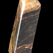 Chocolate Calcite obelisk 118*33*28mm 236g in sunlight - Rocks and Things Store