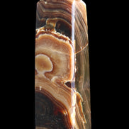 Chocolate Calcite obelisk 118*33*28mm 236g in sunlight - Rocks and Things Store