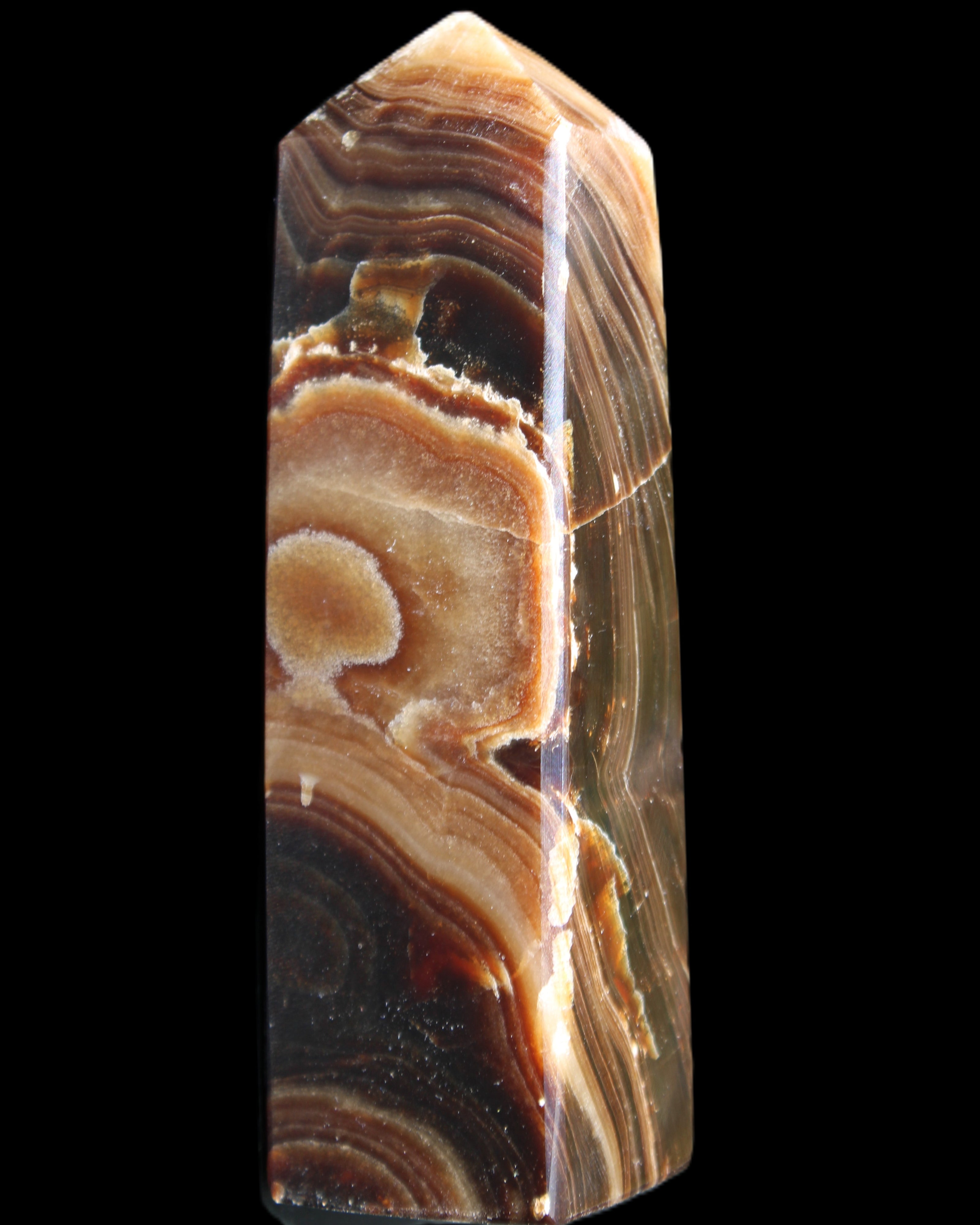 Chocolate Calcite obelisk 118*33*28mm 236g in sunlight - Rocks and Things Store