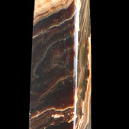 Chocolate Calcite obelisk 118*33*28mm 236g in sunlight - Rocks and Things Store