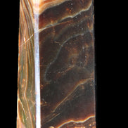 Chocolate Calcite obelisk 118*33*28mm 236g in sunlight - Rocks and Things Store