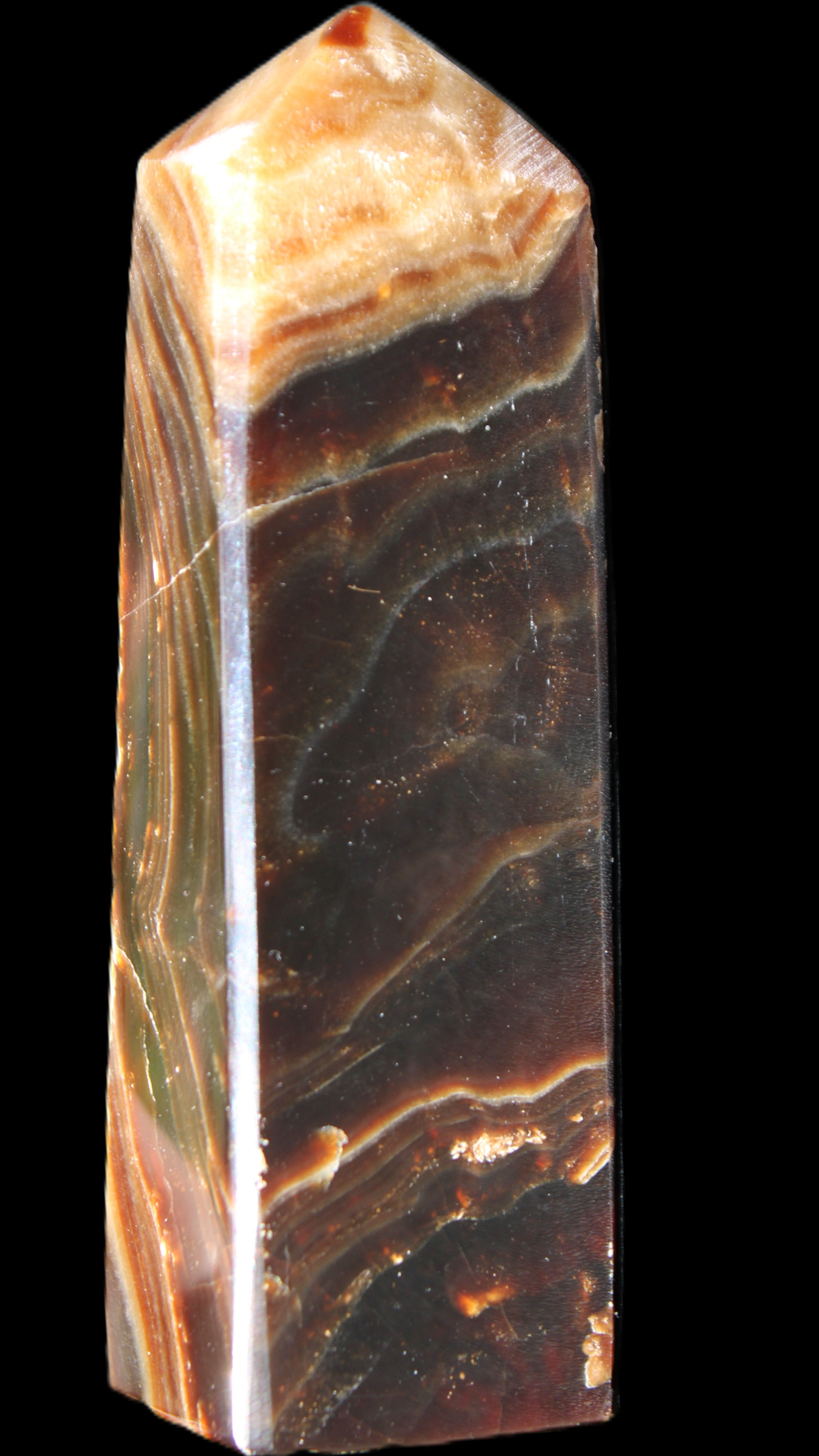 Chocolate Calcite obelisk 118*33*28mm 236g in sunlight - Rocks and Things Store