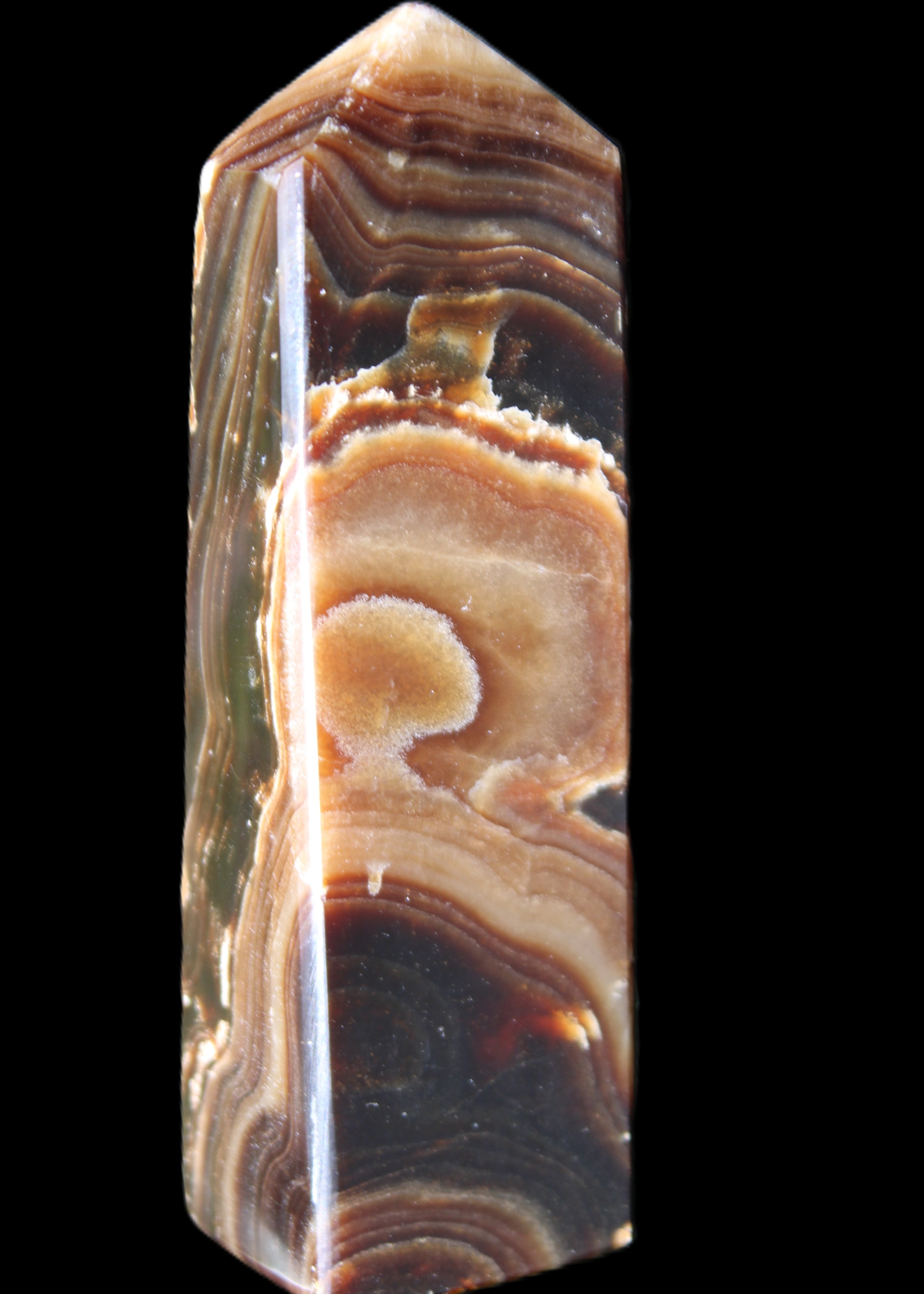 Chocolate Calcite obelisk 118*33*28mm 236g in sunlight - Rocks and Things Store