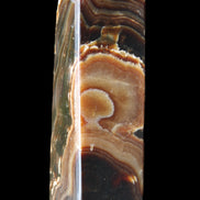 Chocolate Calcite obelisk 118*33*28mm 236g in sunlight - Rocks and Things Store