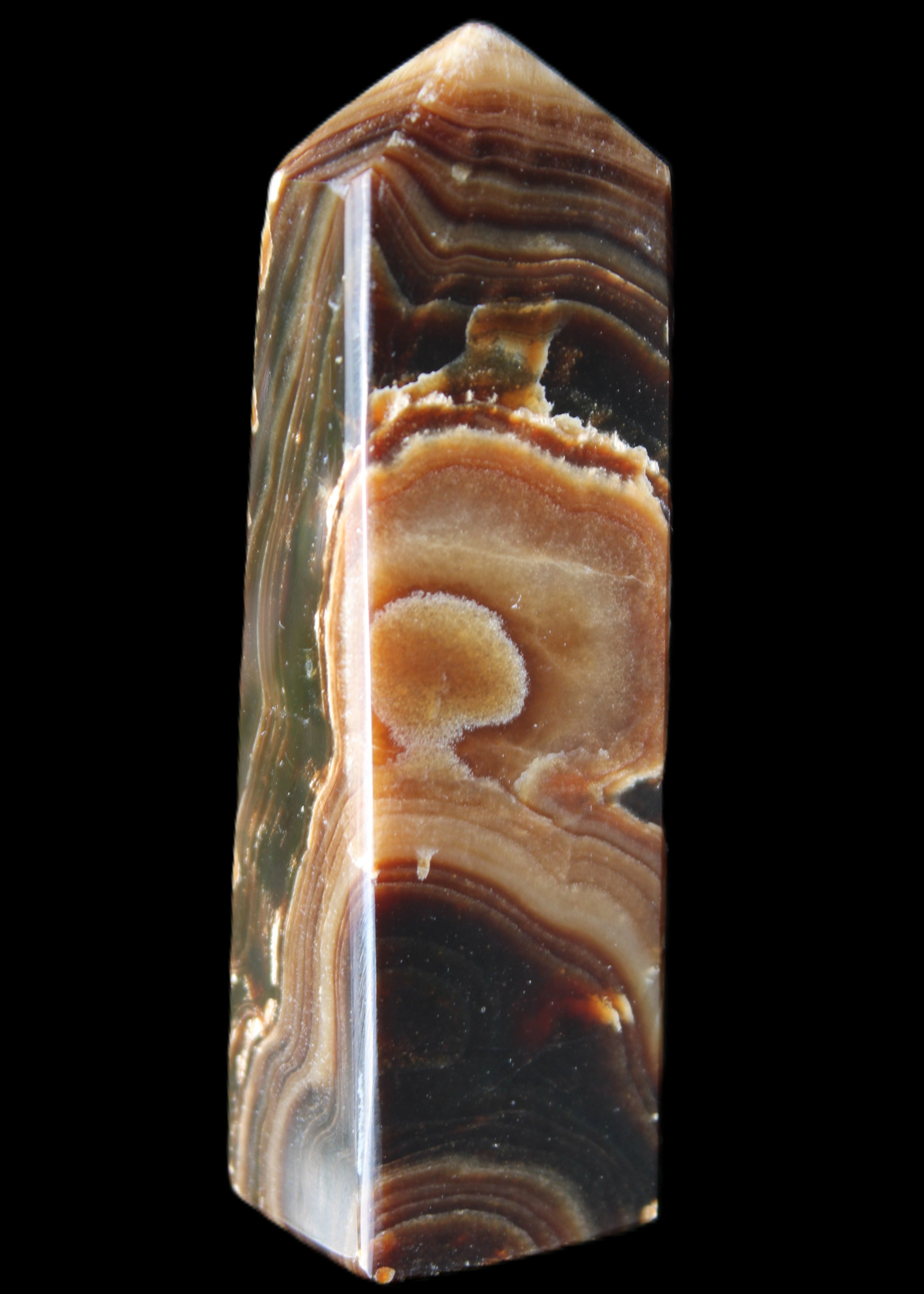 Chocolate Calcite obelisk 118*33*28mm 236g in sunlight - Rocks and Things Store