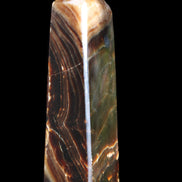 Chocolate Calcite obelisk 118*33*28mm 236g in sunlight - Rocks and Things Store