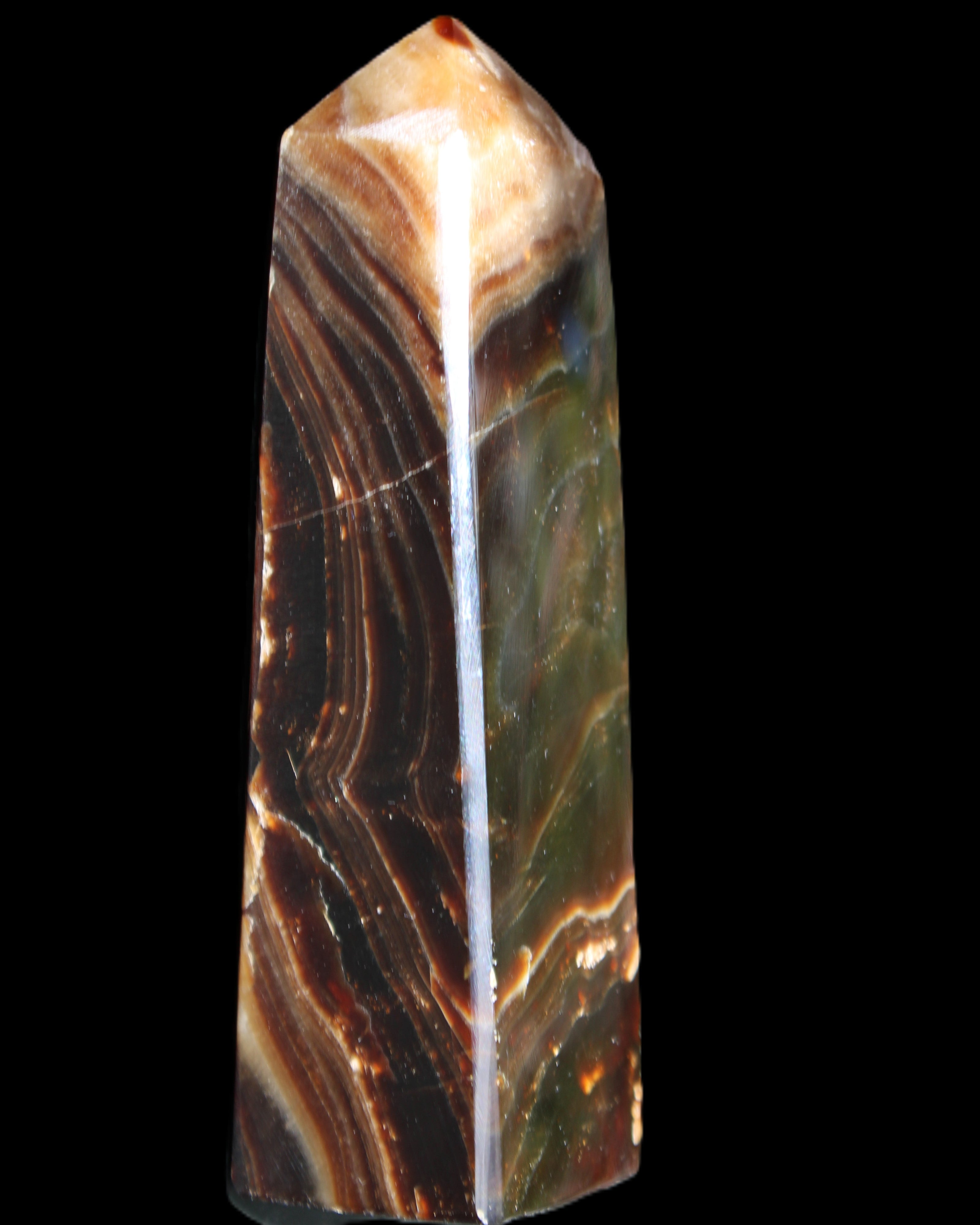 Chocolate Calcite obelisk 118*33*28mm 236g in sunlight - Rocks and Things Store