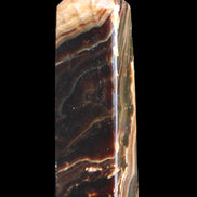 Chocolate Calcite obelisk 118*33*28mm 236g in sunlight - Rocks and Things Store