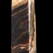 Chocolate Calcite obelisk 118*33*28mm 236g in sunlight - Rocks and Things Store