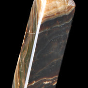 Chocolate Calcite obelisk 118*33*28mm 236g in sunlight - Rocks and Things Store