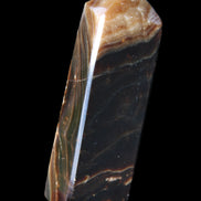 Chocolate Calcite obelisk 118*33*28mm 236g in sunlight - Rocks and Things Store