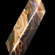 Chocolate Calcite obelisk 118*33*28mm 236g in sunlight - Rocks and Things Store