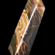 Chocolate Calcite obelisk 118*33*28mm 236g in sunlight - Rocks and Things Store