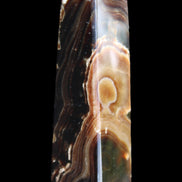Chocolate Calcite obelisk 118*33*28mm 236g in sunlight - Rocks and Things Store