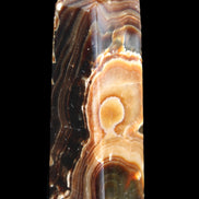 Chocolate Calcite obelisk 118*33*28mm 236g in sunlight - Rocks and Things Store