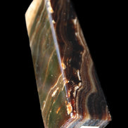 Chocolate Calcite obelisk 118*33*28mm 236g in sunlight - Rocks and Things Store
