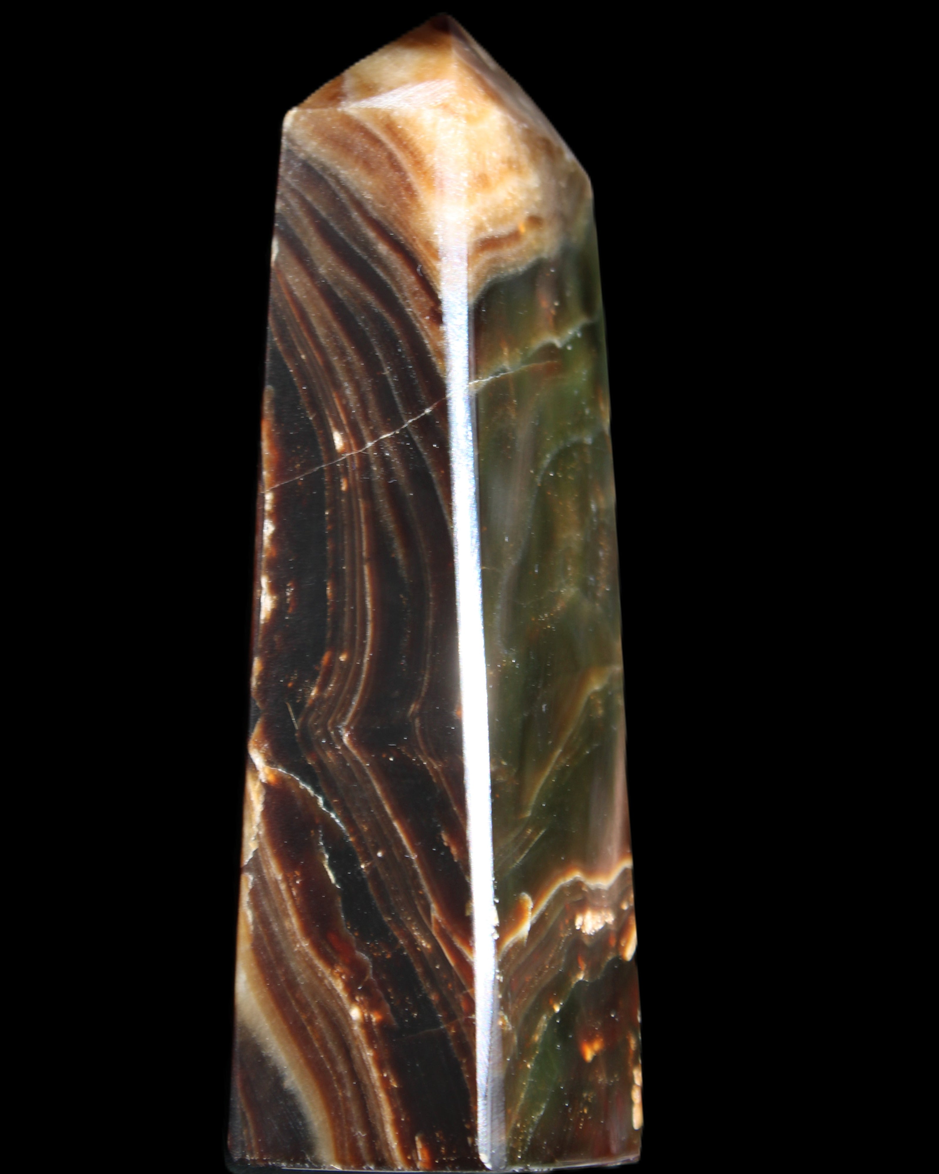 Chocolate Calcite obelisk 118*33*28mm 236g in sunlight - Rocks and Things Store