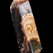 Chocolate Calcite obelisk 118*33*28mm 236g in sunlight - Rocks and Things Store