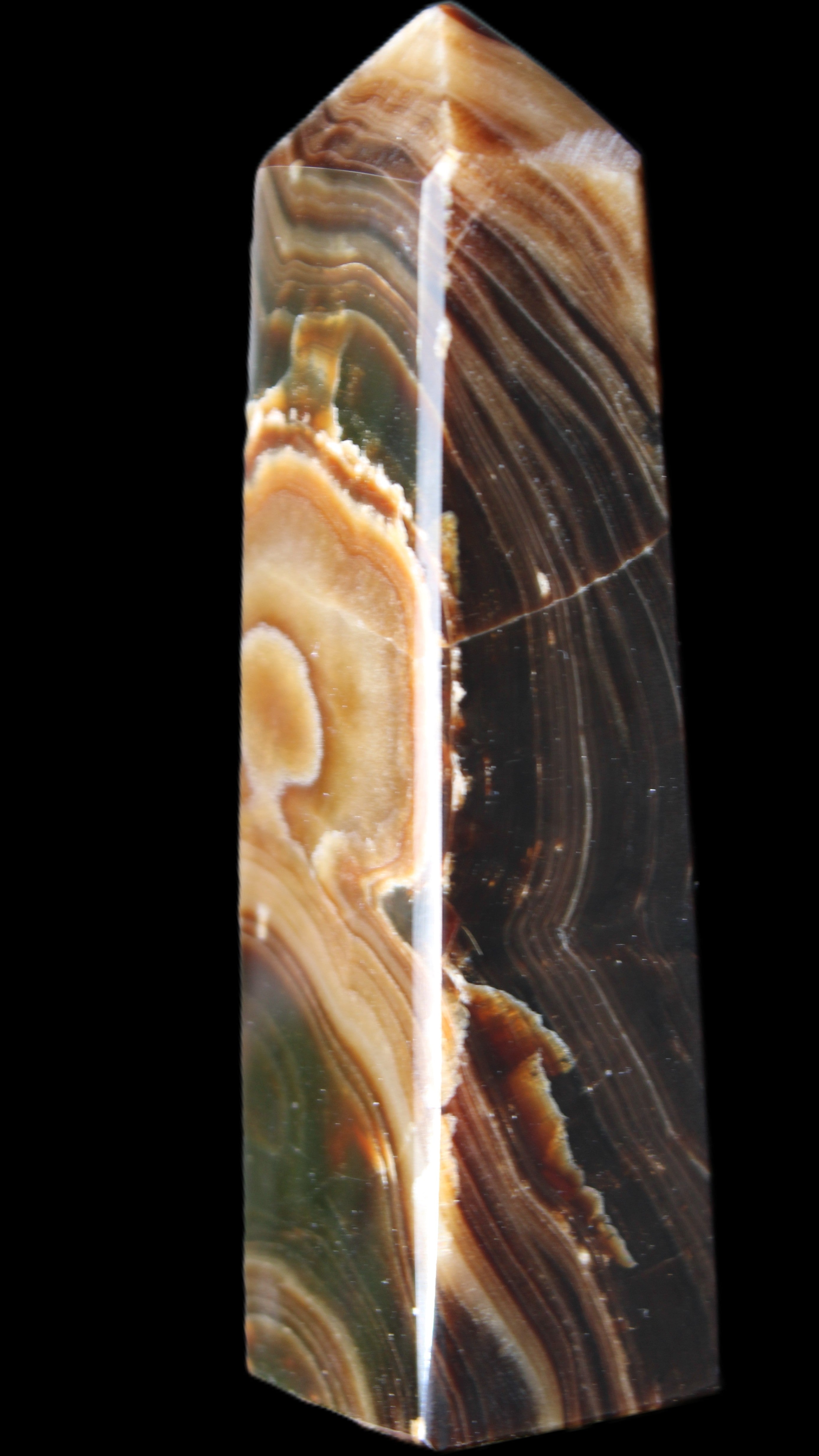 Chocolate Calcite obelisk 118*33*28mm 236g in sunlight - Rocks and Things Store