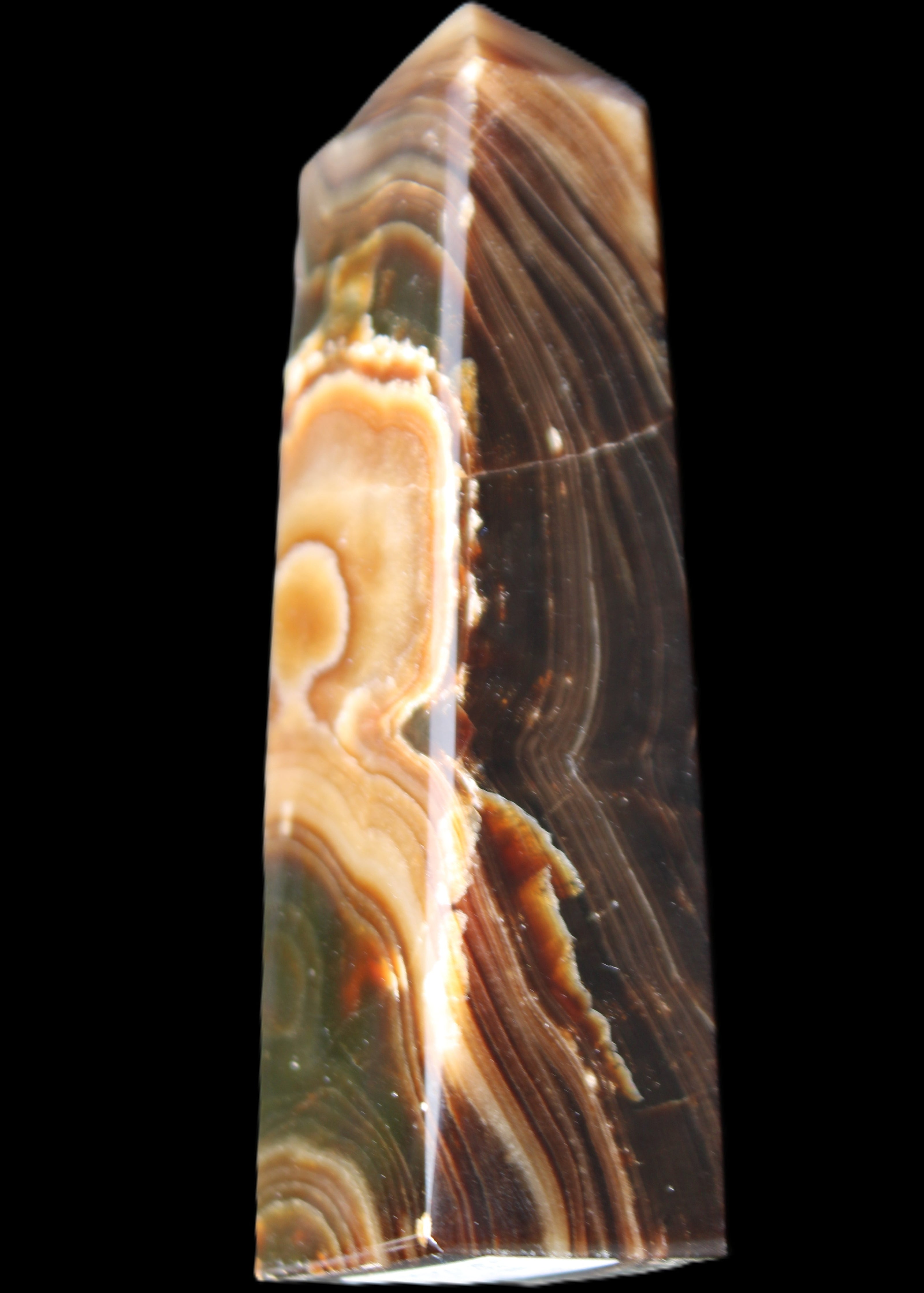 Chocolate Calcite obelisk 118*33*28mm 236g in sunlight - Rocks and Things Store