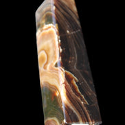 Chocolate Calcite obelisk 118*33*28mm 236g in sunlight - Rocks and Things Store