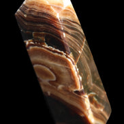 Chocolate Calcite obelisk 118*33*28mm 236g in sunlight - Rocks and Things Store