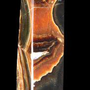 Chocolate Calcite obelisk 107*33*32mm 236g in sunlight - Rocks and Things Store