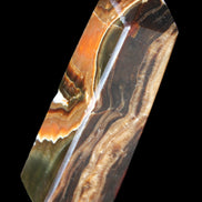 Chocolate Calcite obelisk 107*33*32mm 236g in sunlight - Rocks and Things Store