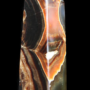 Chocolate Calcite obelisk 107*33*32mm 236g in sunlight - Rocks and Things Store