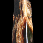 Chocolate Calcite obelisk 107*33*32mm 236g in sunlight - Rocks and Things Store