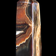 Chocolate Calcite obelisk 107*33*32mm 236g in sunlight - Rocks and Things Store