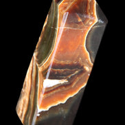 Chocolate Calcite obelisk 107*33*32mm 236g in sunlight - Rocks and Things Store