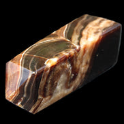 Chocolate Calcite obelisk 107*33*32mm 236g in sunlight - Rocks and Things Store