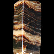 Chocolate Calcite obelisk 98*32*30mm 253g in sunlight - Rocks and Things Store