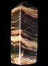 Chocolate Calcite obelisk 98*32*30mm 253g in sunlight - Rocks and Things Store