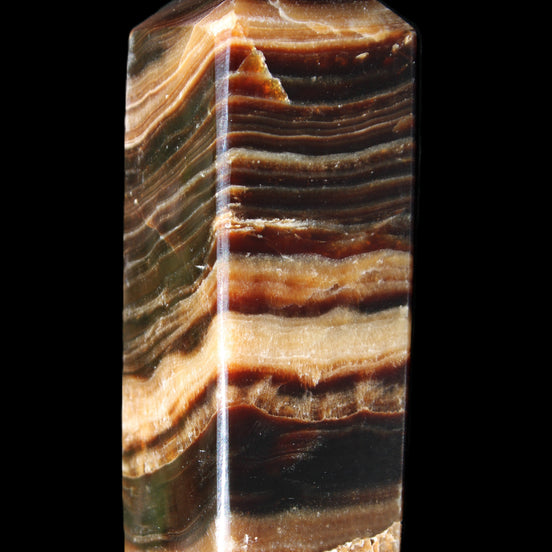 Chocolate Calcite obelisk 98*32*30mm 253g in sunlight - Rocks and Things Store