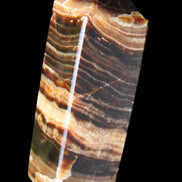 Chocolate Calcite obelisk 98*32*30mm 253g in sunlight - Rocks and Things Store