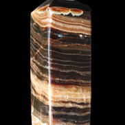Chocolate Calcite obelisk 98*32*30mm 253g in sunlight - Rocks and Things Store