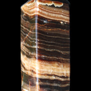 Chocolate Calcite obelisk 98*32*30mm 253g in sunlight - Rocks and Things Store