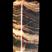 Chocolate Calcite obelisk 98*32*30mm 253g in sunlight - Rocks and Things Store