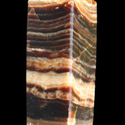 Chocolate Calcite obelisk 98*32*30mm 253g in sunlight - Rocks and Things Store