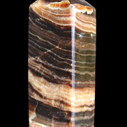 Chocolate Calcite obelisk 98*32*30mm 253g in sunlight - Rocks and Things Store